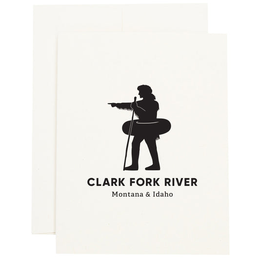 Silhouette of explorer William Clark pointing with an inner tube around his waist to signify the Clark Fork River in Missoula, MT on a greeting card.