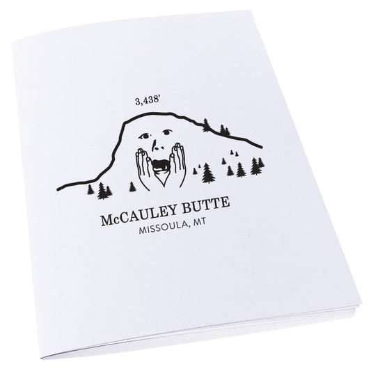 An image of a worried McCauley Butte in Missoula, Montana on a notebook.