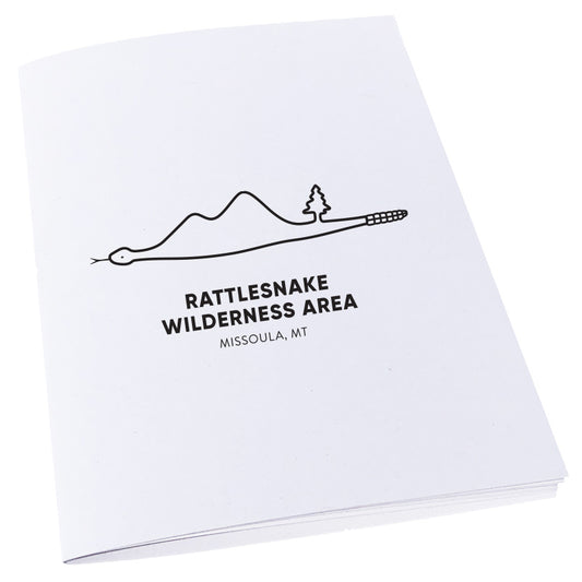 Image of Rattlesnake Wilderness Area in Missoula, Montana inside of a snake on a notebook.