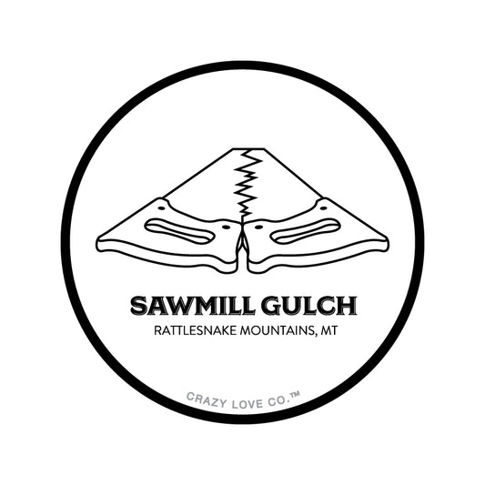 Image of two saws placed tooth-edge to tooth-edge to represent Sawmill Gulch in Missoula, MT on a sticker.