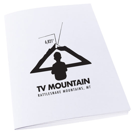 Image of a boy looking at a mountain as if it is a television to represent TV Mountain in Missoula, MT on a notebook.