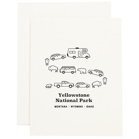 Image of a traffic jam at Yellowstone National Park in Montana, Wyoming, and Idaho with cars, campers, bears, and bison on a greeting card.